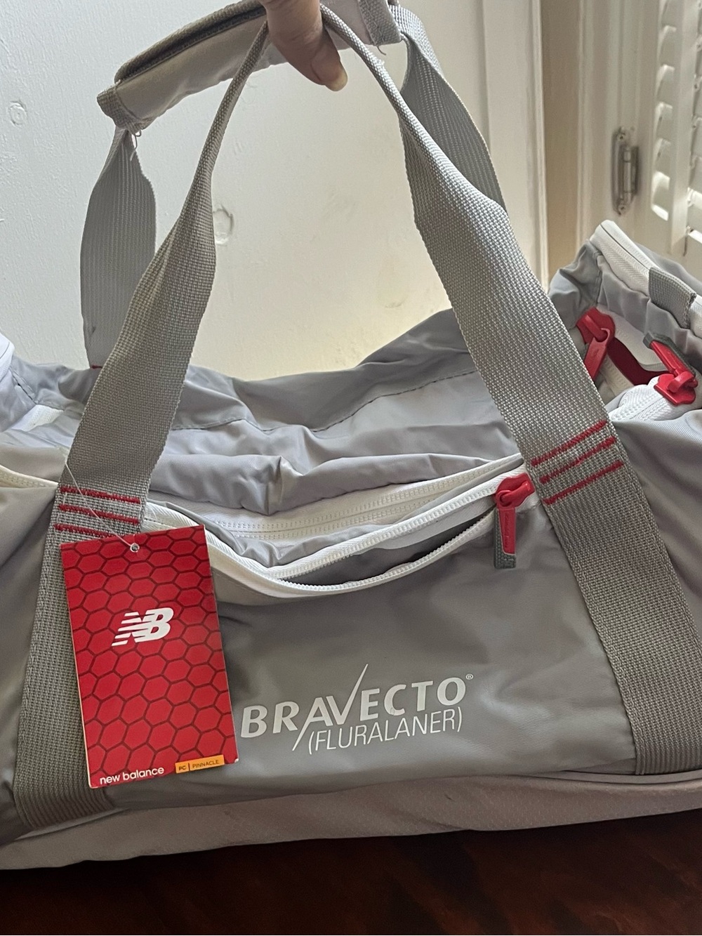 New Balance Gray Duffel with Red Accents
